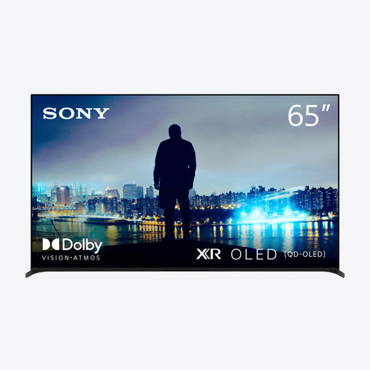 Sony 65-inch TV display with cityscape and silhouette of a person, featuring Dolby Vision and Atmos logos.